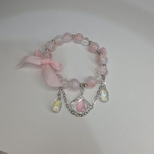 Elegant Pink Beaded Bracelet with Bow and Charms